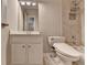 Bright bathroom featuring a single vanity, tile shower, and modern toilet in a neutral color palette at 3237 Birkdale Ave, Duluth, GA 30097