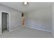 Empty bedroom with neutral walls and carpet, featuring multiple doorways at 3237 Birkdale Ave, Duluth, GA 30097