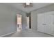 Bedroom featuring double closets, an ensuite bathroom, and neutral colored paint and carpet at 3237 Birkdale Ave, Duluth, GA 30097