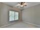 Bedroom with neutral walls, carpet, a ceiling fan and a window offering natural light at 3237 Birkdale Ave, Duluth, GA 30097