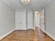 Bedroom features hardwood floors, closet space, and neutral paint at 3237 Birkdale Ave, Duluth, GA 30097