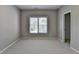 Empty bedroom with neutral walls and carpet, featuring a window and a closet at 3237 Birkdale Ave, Duluth, GA 30097