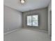 Empty bedroom with neutral walls and carpet, featuring a window at 3237 Birkdale Ave, Duluth, GA 30097