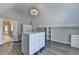 Spacious walk-in closet with center island storage and wood laminate flooring at 3237 Birkdale Ave, Duluth, GA 30097