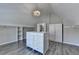 Spacious walk-in closet with center island storage and wood laminate flooring at 3237 Birkdale Ave, Duluth, GA 30097