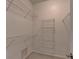 An empty walk in closet with wire shelving and carpeted floor at 3237 Birkdale Ave, Duluth, GA 30097