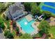 A luxurious pool complex features a sprawling pool, a water slide, and beautiful landscaping at 3237 Birkdale Ave, Duluth, GA 30097