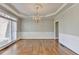 Formal dining room with decorative molding and chandelier at 3237 Birkdale Ave, Duluth, GA 30097