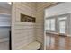 Charming entryway with shiplap accent wall, bench, and closet space at 3237 Birkdale Ave, Duluth, GA 30097
