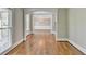 Open foyer showcasing hardwood floors, arched entryway and view of dining room at 3237 Birkdale Ave, Duluth, GA 30097
