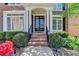 Inviting front porch with brick steps and lush landscaping at 3237 Birkdale Ave, Duluth, GA 30097