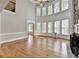 Spacious great room with soaring ceilings, a fireplace, and a wall of windows providing natural light at 3237 Birkdale Ave, Duluth, GA 30097
