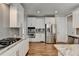 Spacious kitchen with stainless steel appliances, granite countertops, and white cabinets at 3237 Birkdale Ave, Duluth, GA 30097