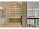 Upstairs landing with built-in desk, shelves, and railing overlooking the foyer at 3237 Birkdale Ave, Duluth, GA 30097