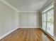 Comfortable living area with hardwood floors, neutral walls, and window allowing plenty of natural light at 3237 Birkdale Ave, Duluth, GA 30097