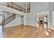 Living room featuring a staircase, fireplace, and hardwood floors at 3237 Birkdale Ave, Duluth, GA 30097