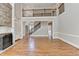 Living room showcasing hardwood floors, a staircase, and fireplace at 3237 Birkdale Ave, Duluth, GA 30097