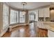 Bright and open living room features large windows, chandelier, and hardwood floors at 3237 Birkdale Ave, Duluth, GA 30097