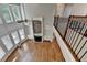 Stunning living room featuring a stone fireplace, built-in shelves, soaring ceilings, and abundant natural light from large windows at 3237 Birkdale Ave, Duluth, GA 30097