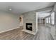 Bright living room with wood-style floors, and a brick fireplace feature at 3237 Birkdale Ave, Duluth, GA 30097