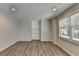 Cozy living room featuring built-in shelving, recessed lighting, and natural light from a window at 3237 Birkdale Ave, Duluth, GA 30097