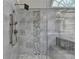 This bathroom has a glass enclosed shower featuring pebble accents and a built-in bench at 3237 Birkdale Ave, Duluth, GA 30097