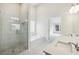 Bathroom features dual sinks, a walk-in shower, a tub, and bright modern lighting at 5827 Creek Indian Dr, Sugar Hill, GA 30518