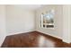 Cozy bedroom with hardwood floors and a view of the outdoors at 5827 Creek Indian Dr, Sugar Hill, GA 30518