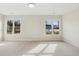 Spacious bedroom with plush carpeting and dual windows for natural light and ventilation at 5827 Creek Indian Dr, Sugar Hill, GA 30518