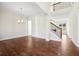Bright and airy living room with hardwood floors and staircase at 5827 Creek Indian Dr, Sugar Hill, GA 30518