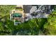 A manicured backyard includes a pool, gazebo, seating area, and expansive lawn in this aerial view at 725 Riley Pl, Atlanta, GA 30327