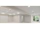 Open basement area with large window and closet with folding doors at 725 Riley Pl, Atlanta, GA 30327