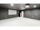 Dark basement theater room with projector and screen, perfect for movie nights and entertainment at 725 Riley Pl, Atlanta, GA 30327