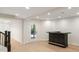Basement with a bar, with light wood flooring, and a glass door leading to the outside, an ideal space for relaxation at 725 Riley Pl, Atlanta, GA 30327