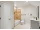 Spacious bathroom with modern fixtures, decorative tile, and a tub shower at 725 Riley Pl, Atlanta, GA 30327