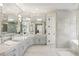 Spacious bathroom with a modern design featuring marble countertops and a seamless mirror at 725 Riley Pl, Atlanta, GA 30327