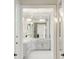 Bright bathroom with marble countertops, modern fixtures, and a seamless mirror at 725 Riley Pl, Atlanta, GA 30327