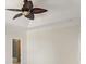 Neutral bedroom featuring an elegant ceiling fan, neutral walls, and access to an ensuite bathroom at 725 Riley Pl, Atlanta, GA 30327