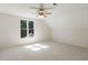 Bright and airy bedroom with a large window and neutral carpeting at 725 Riley Pl, Atlanta, GA 30327