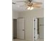 Cozy bedroom with a ceiling fan and doors leading to other rooms at 725 Riley Pl, Atlanta, GA 30327