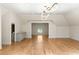 Bright bonus room featuring hardwood floors and a unique round window at 725 Riley Pl, Atlanta, GA 30327