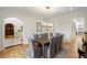 Dining room with views into library with custom built-ins and decorative arched doorway at 725 Riley Pl, Atlanta, GA 30327