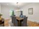 Formal dining room featuring a modern chandelier and large window overlooking the yard at 725 Riley Pl, Atlanta, GA 30327