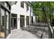 Gorgeous exterior with gray deck, black framed windows and doors, and green foliage at 725 Riley Pl, Atlanta, GA 30327