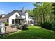 Beautiful home exterior featuring a large backyard, gazebo, and lush landscaping for outdoor enjoyment at 725 Riley Pl, Atlanta, GA 30327