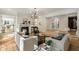 Open-concept living room with hardwood floors, neutral furnishings, and an elegant fireplace at 725 Riley Pl, Atlanta, GA 30327