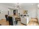 Bright living room featuring hardwood floors, a modern chandelier, and a neutral color palette at 725 Riley Pl, Atlanta, GA 30327
