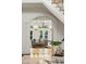 Open living room with white trim, hardwood floors, and an archway view to the staircase at 725 Riley Pl, Atlanta, GA 30327