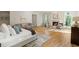 Spacious main bedroom with fireplace, sitting area, wood floors and natural light at 725 Riley Pl, Atlanta, GA 30327