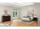 Spacious main bedroom with hardwood floors, ensuite bath and walk-out balcony at 725 Riley Pl, Atlanta, GA 30327